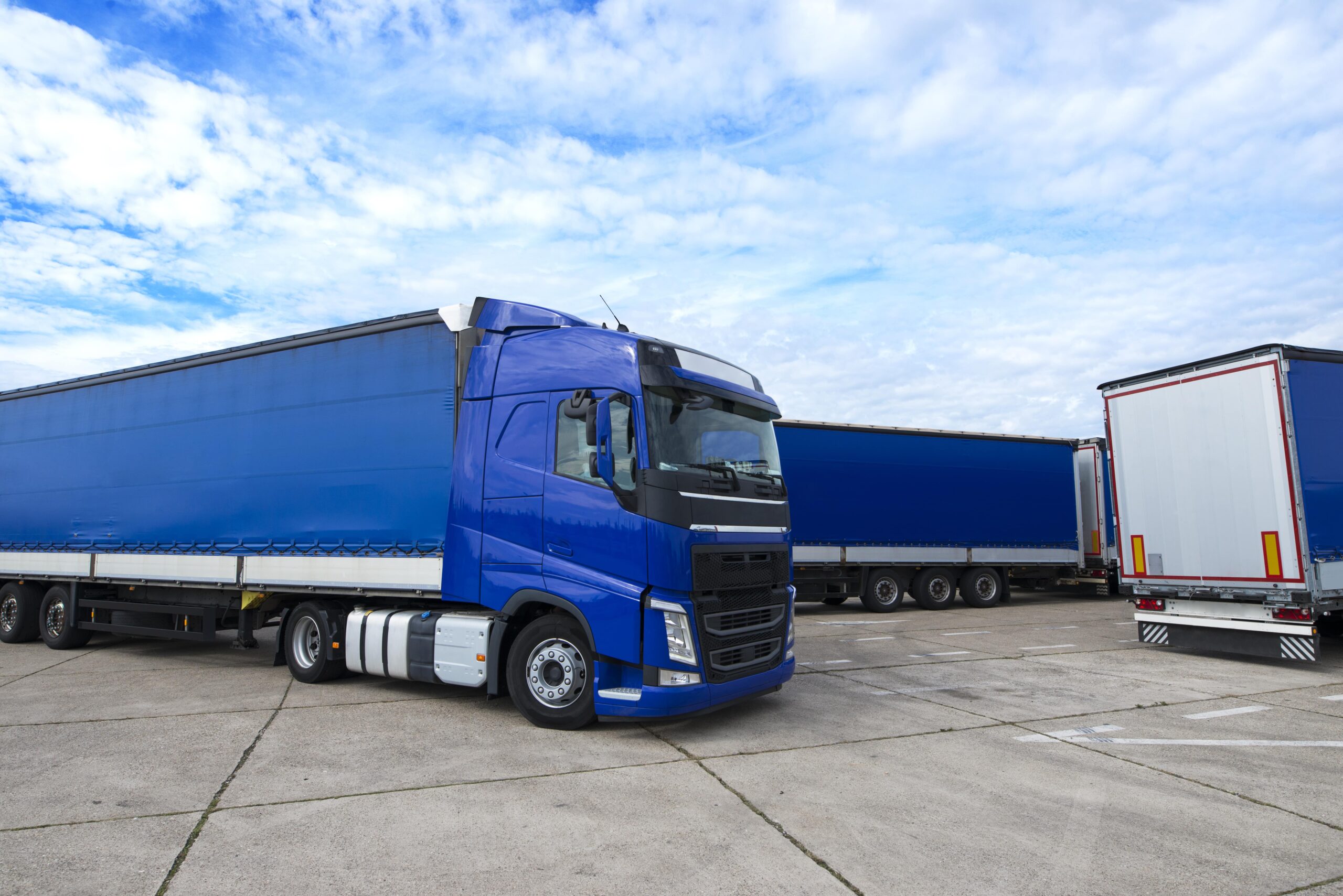 truck-vehicle-with-trailers-background-min-scaled